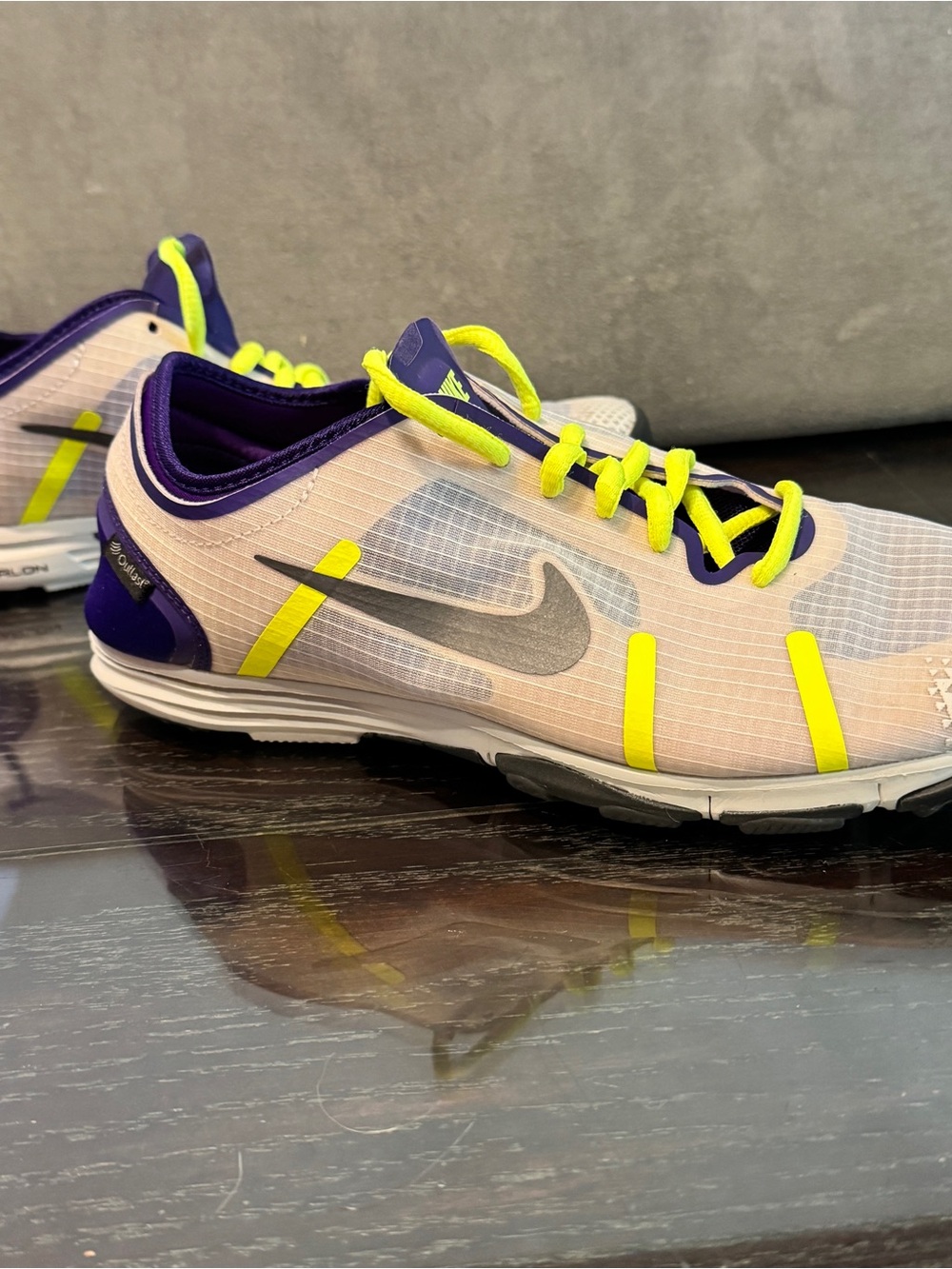 Nike Women's Neutral-Base Athletic Shoes with Neon Yellow and Purple Accents